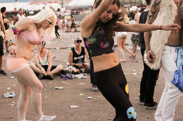 Fans conitnue dancing as the sun rises during Headhunterz set at the Electric Daisy Carnival Festival, EDC, at the Las Vegas Motor Speedway, Sunday morning, June 23, 2013.
