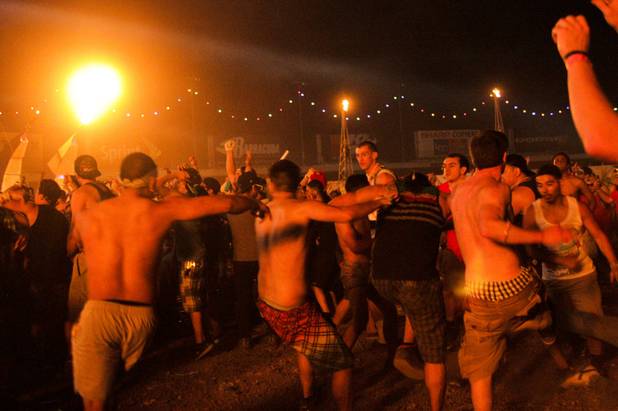 Fans mosh during the Dirtyphonic's set at the Electric Daisy Carnival Festival, EDC, at the Las Vegas Motor Speedway, Sunday morning, June 23, 2013.