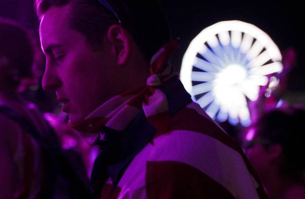 A fan closes his eyes while enjoying the Benny Benassi set at the Electric Daisy Carnival Festival, EDC, at the Las Vegas Motor Speedway, Sunday morning, June 23, 2013.