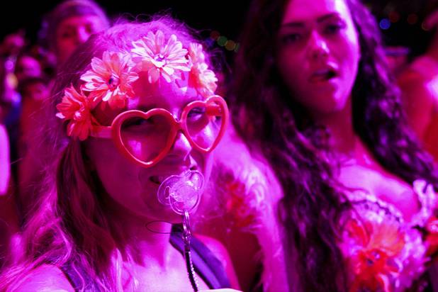 Fans enjoy the Benny Benassi at the Electric Daisy Carnival Festival, EDC, at the Las Vegas Motor Speedway, Sunday morning, June 23, 2013.