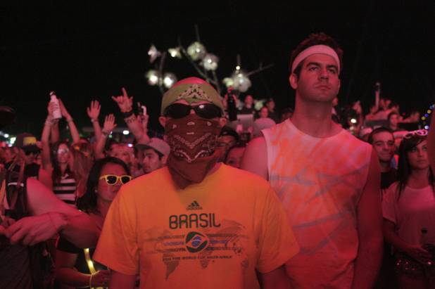 Fans look on during the Benny Benassi set at the Electric Daisy Carnival Festival, EDC, at the Las Vegas Motor Speedway, Sunday morning, June 23, 2013.