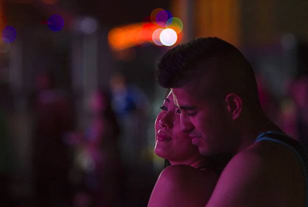 Cecilia Lee, 23, and Rismi Chadha, 25, listen to music by the bassCON stage during the third day of the Electric Daisy Carnival at the Las Vegas Motor Speedway Sunday, June 23, 2013.