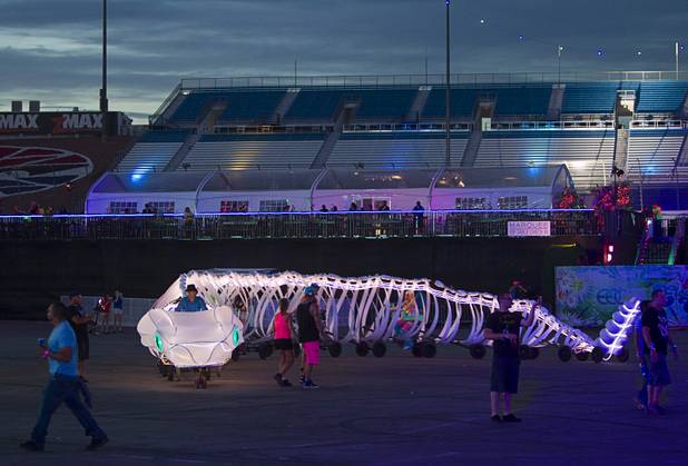 A snake bike travels by the kinetic FIELD during the third day of the Electric Daisy Carnival at the Las Vegas Motor Speedway Sunday, June 23, 2013.
