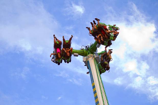 Festival-goers are inverted as they spin on a ride called Insanity during the third day of the Electric Daisy Carnival at the Las Vegas Motor Speedway Sunday, June 23, 2013.
