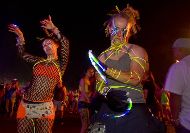 Natalie Joseph, 28, and Seth "Chaos" Joseph dance during the third day of the Electric Daisy Carnival at the Las Vegas Motor Speedway Sunday, June 23, 2013.