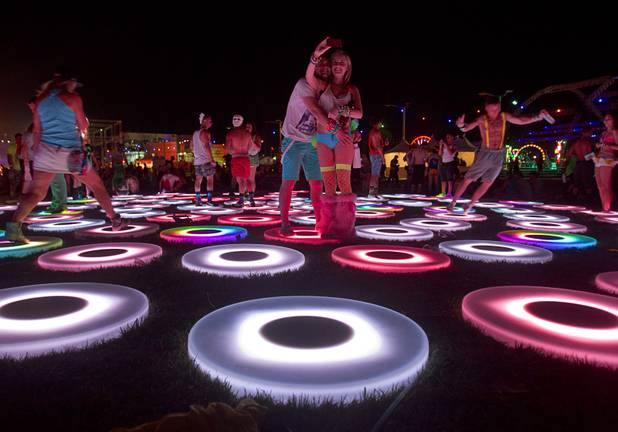A couple takes a self-portrait during the third day of the Electric Daisy Carnival at the Las Vegas Motor Speedway early Monday morning, June 24, 2013.