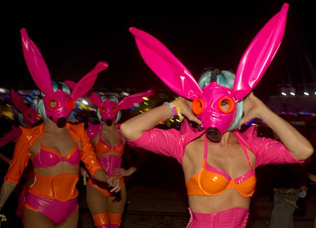 A performer poses as she makes her way to a stage during the third day of the Electric Daisy Carnival at the Las Vegas Motor Speedway early Monday morning, June 24, 2013.