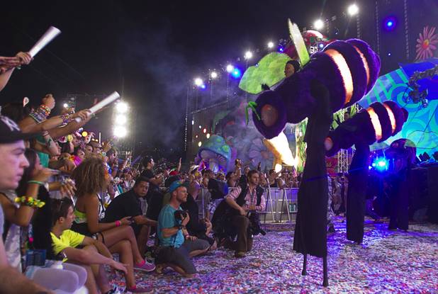 Performers dressed as giant bees entertain the audience during the third day of the Electric Daisy Carnival at the Las Vegas Motor Speedway early Monday morning, June 24, 2013.
