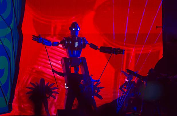 A puppeteer operates a giant robot puppet during the third day of the Electric Daisy Carnival at the Las Vegas Motor Speedway early Monday morning, June 24, 2013.