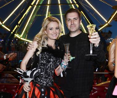 Holly Madison and Pasquale Rotella pose for photos in front of the Ferris wheel where he asked for her hand in marriage during the 17th annual Electric Daisy Carnival at Las Vegas Motor Speedway on Sunday, June 23, 2013.