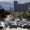 Cars make their way down U.S. Highway 50 toward Stateline on Thursday, June 6, 2013, in South Lake Tahoe, Calif. The Tahoe Transportation District plans to turn a 1.1-mile section of the current highway, from Pioneer Trail in California to Lake Parkway in Nevada, into a local "main street." The problem is that the planned "loop road" replacing the highway would have to be built through at least one neighborhood.