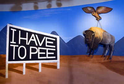 Artwork, right, by Su Limbert is displayed at the Route 66 art exhibit at the Springs Preserve Tuesday, June 25, 2013. The exhibit opens to the public on Friday. The background mural is by JW Caldwell.