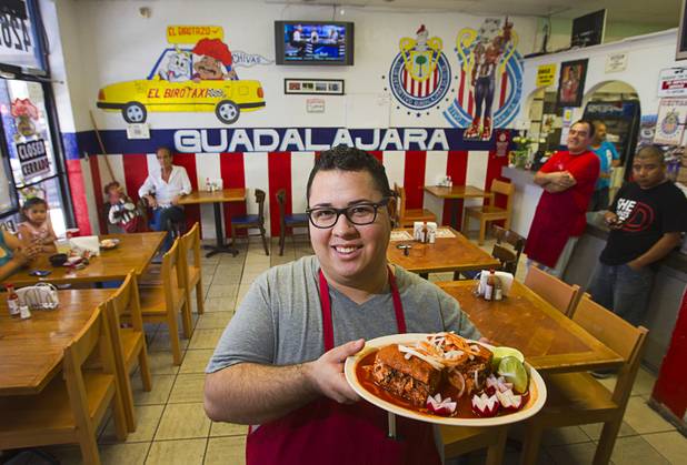 Giovanni Vargas holds a torta ahoggada, a traditional Guadalajara dish, at the El Birotazo Mexican restaurant, 4262 E. Charleston Blvd., Wednesday, June 26, 2013. The restaurant owners are huge fans of the Chivas soccer team. Chivas (Guadalajara) and Club America (Mexico City), two of the most popular soccer teams in Mexico, play each other at Sam Boyd Stadium on Wednesday, July 3.