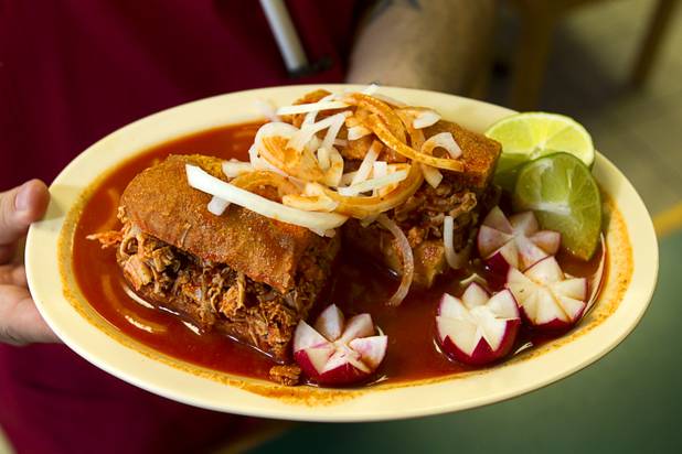 Giovanni Vargas holds a torta ahoggada, a traditional Guadalajara dish, at the El Birotazo Mexican restaurant, 4262 E. Charleston Blvd., Wednesday, June 26, 2013. The restaurant owners are huge fans of the Chivas soccer team. Chivas (Guadalajara) and Club America (Mexico City), two of the most popular soccer teams in Mexico, play each other at Sam Boyd Stadium on Wednesday, July 3.