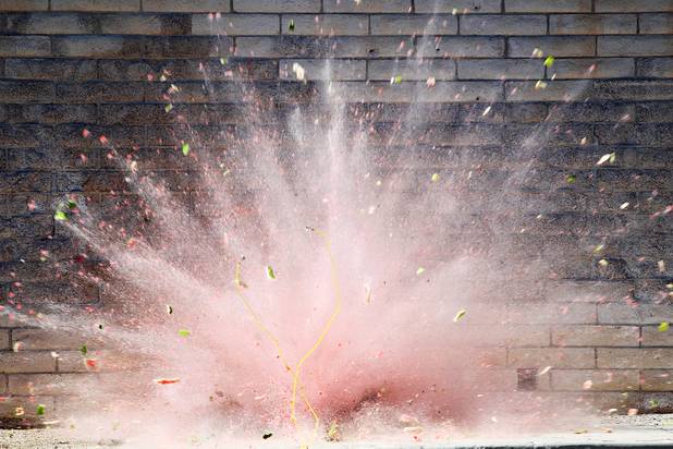 A watermelon is blown up with a blasting cap during the Las Vegas Fire Department's annual July 4th fireworks safety demonstration Wednesday, June 26, 2013
