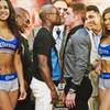 Floyd Mayweather, center left, poses in a face-off with Saul "Canelo" Alvarez during a boxing news conference on Monday, June 24, 2013, at New York's Times Square. MayWeather and Alvarez kicked-off an 11-city promotional, making their fight in Las Vegas in September official. The undefeated fighters announced on Twitter last month that they would face each other at the MGM Grand on Sept. 14. (AP Photo/Bebeto Matthews)