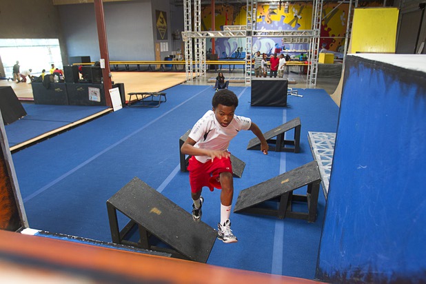 Joshua Rowry, 13, a member of the Victory Baptist Church STARS Youth Ministry, runs through an obstacle course at the Hardkore Parkour (HKPK) gym, 3680 N. 5th St., Thursday, June 27, 2013.