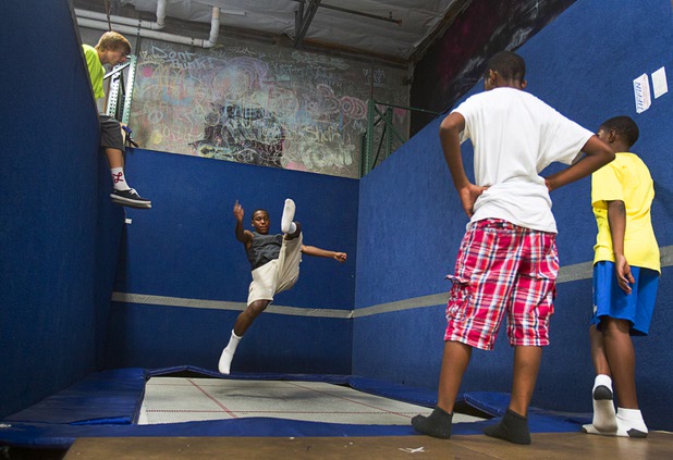 Members of the Victory Baptist Church STARS Youth Ministry take turns on a trampoline at the Hardkore Parkour (HKPK) gym, 3680 N. 5th St., Thursday, June 27, 2013.