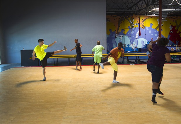 Instructor Jay Cox, left, leads a group from Victory Baptist Church STARS Youth Ministry at the Hardkore Parkour (HKPK) gym, 3680 N. 5th St., Thursday, June 27, 2013.