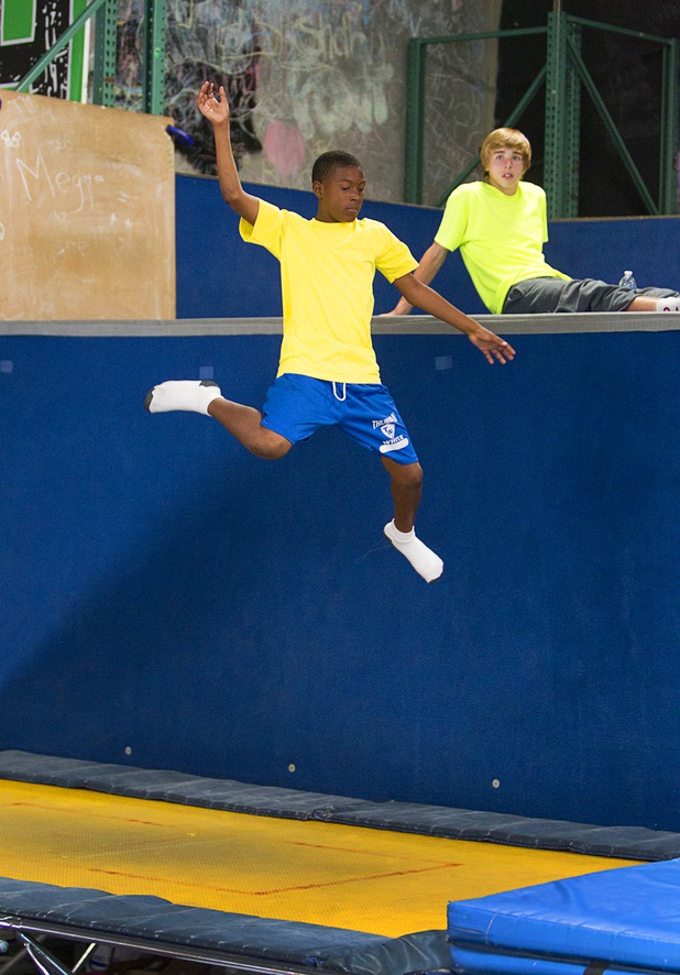 Tavion Lucas, 12, a member of the Victory Baptist Church Stars Youth Ministry, jumps on a trampoline at the Hardkore Parkour (HKPK) gym, 3680 N. 5th St., Thursday, June 27, 2013.