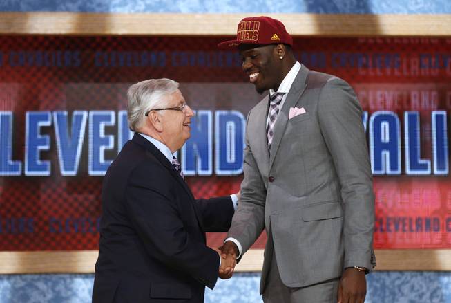 NBA Commissioner David Stern, left, shakes hands with UNLV's Anthony Bennett, who was selected first overall by the Cleveland Cavaliers in the NBA basketball draft, Thursday, June 27, 2013, in New York. 