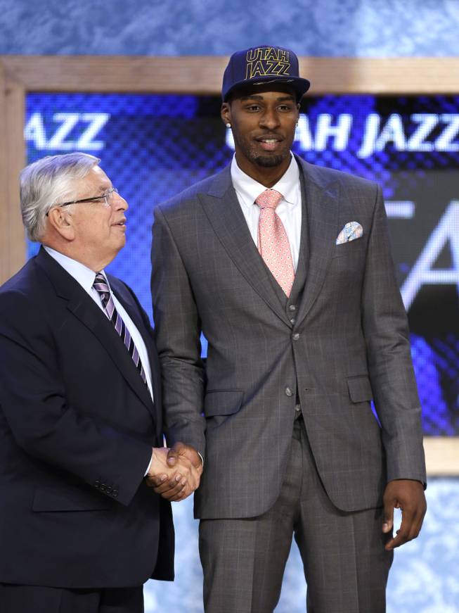 NBA Commissioner David Stern, left, shakes hands with UCLA's Shabazz Muhammad, who was selected by the Utah Jazz in the first round of the NBA basketball draft, Thursday, June 27, 2013, in New York.