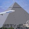 An Allegiant Air jetliner flies by the Luxor after taking off from McCarran International Airport, Thursday, May 9, 2013. While other U.S. airlines have struggled with the ups and downs of the economy and oil prices, Allegiant has been profitable for 12 straight years.
