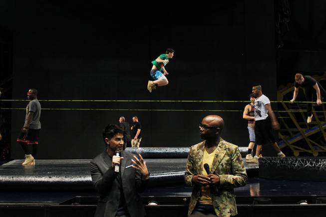 As performers practice on slack lines, Director Jamie King, left, and Creative Director Welby Altidor speak to the media during a tour of the Michael Jackson "One" Theater at Mandalay Bay Saturday, June 29, 2013 before its world premier.