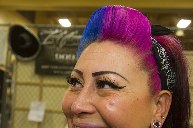 Trina Carillo sports a multi-colored hair style during the inaugural Art N Ink Festival at the South Point Sunday, June 30, 2013.