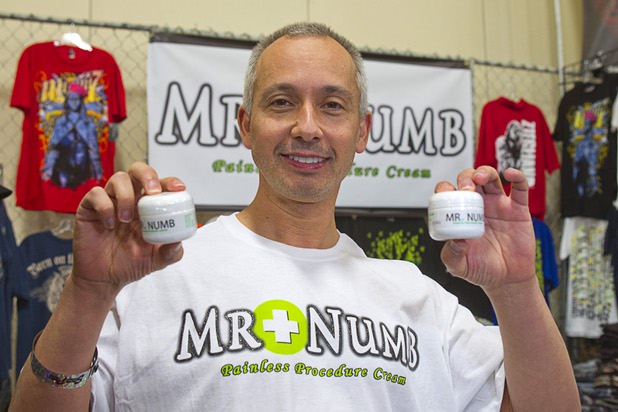Dr. David Watson, an emergency medicine physician, holds containers of Mr. Numb, a numbing cream that is applied to the skin before getting a tattoo, during the inaugural Art N Ink Festival at the South Point Sunday, June 30, 2013. The product is different than the competition because it produces no swelling, no redness and doesn't interfere with tattoo ink, Watson said. He came up with the idea for the numbing cream after listening to fighters talk about painful tattoos, he said.