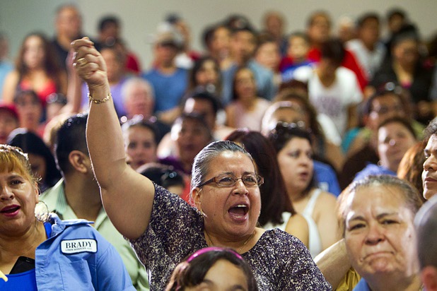 Maria Gudino,a Brady Linen Services employee, cheers during a rally for immigration reform at the Culinary Workers Union, Local 226, headquarters Monday, July 1, 2013.