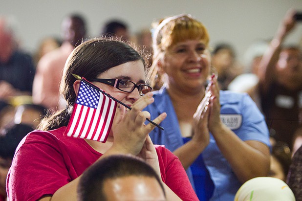 Audience members cheer during a rally for immigration reform at the Culinary Workers Union, Local 226, headquarters Monday, July 1, 2013.