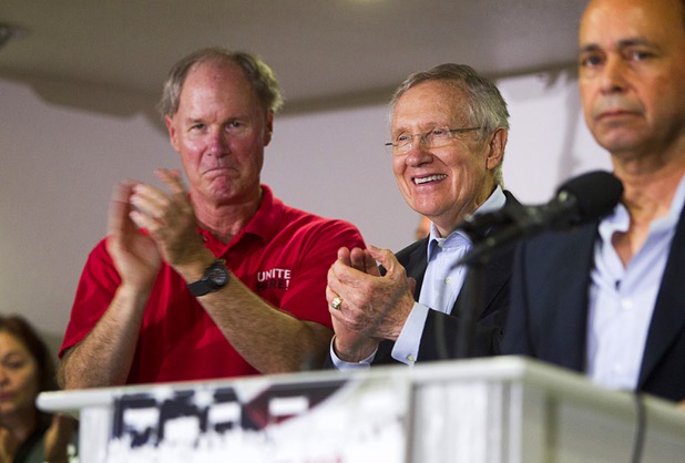 D. Taylor, left, president of UNITE Here, and Senate Majority Leader Harry Reid (D-NV) applaud Congressman Luis Gutierrez (D-IL) as he speaks during a rally for immigration reform at the Culinary Workers Union, Local 226, headquarters Monday, July 1, 2013.
