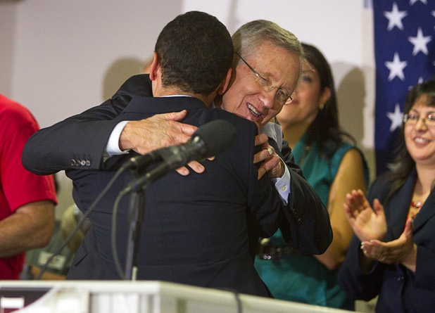 Senate Majority Leader Harry Reid (D-NV) embraces Congressman Luis Gutierrez (D-IL) during a rally for immigration reform at the Culinary Workers Union, Local 226, headquarters Monday, July 1, 2013.