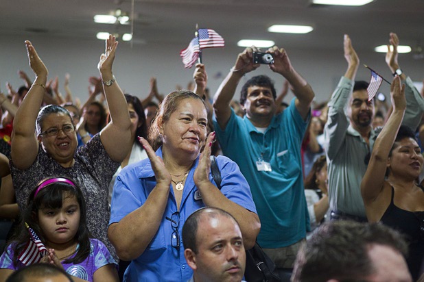Workers applaud during a rally for immigration reform at the Culinary Workers Union, Local 226, headquarters Monday, July 1, 2013.