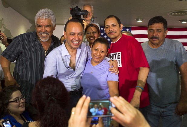 Congressman Luis Gutierrez (D-IL) poses for a photo with union member Maribel Marcial during a rally for immigration reform at the Culinary Workers Union, Local 226, headquarters Monday, July 1, 2013.