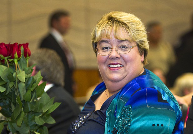 North Las Vegas City Councilwoman Anita Wood holds roses as she waits to be sworn in for a second term during an oath of office ceremony at North Las Vegas City Hall Monday, July 1, 2013.