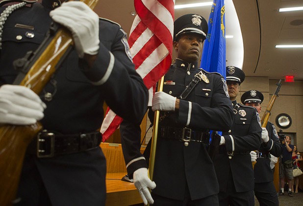 Members of the North Las Vegas Police Honor Guard present the colors during an oath of office ceremony at North Las Vegas City Hall Monday, July 1, 2013.