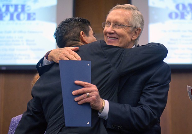 Councilman Isaac Barron, left, embraces Senate Majority Leader Harry Reid (D-NV) during an oath of office ceremony at North Las Vegas City Hall Monday, July 1, 2013. Barron is the first Hispanic to serve on the North Las vegas city council.