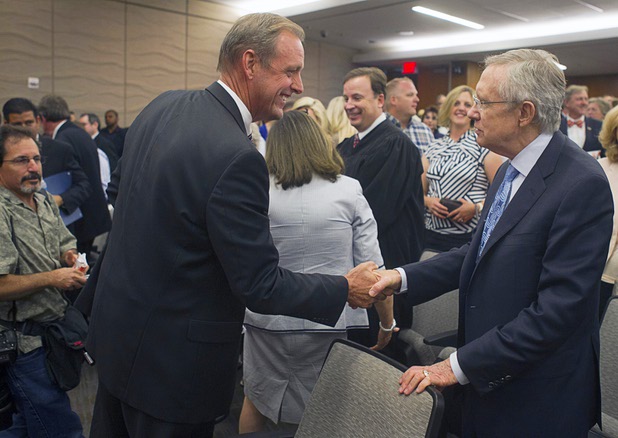 North Las Vegas Mayor John Lee, left, is congratulated by Senate Majority Leader Harry Reid (D-NV) after taking the during an oath of office during a ceremony at North Las Vegas City Hall Monday, July 1, 2013.