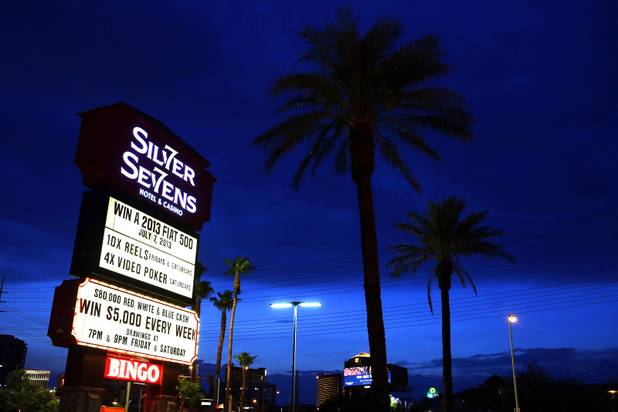 The neon sign at Silver Sevens Hotel & Casino is ceremonially lit in Las Vegas on Monday, July 1, 2013. Silver Sevens Hotel & Casino was formerly known as Terrible's Hotel and Casino.