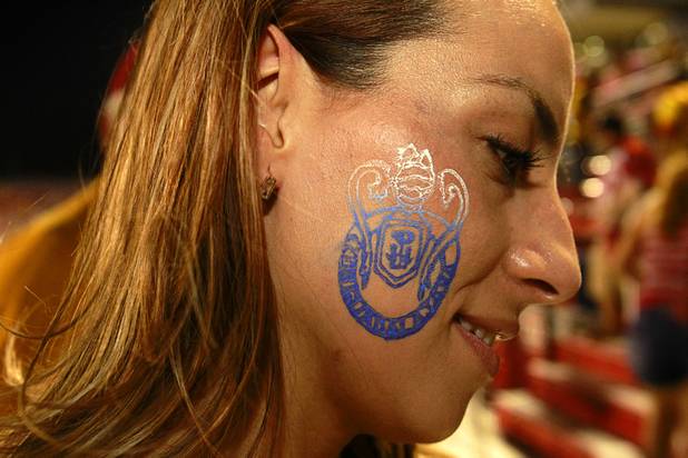 The crest of Chivas Guadalajara adorns the face of a fan during El Super Clasico soccer game at Sam Boyd Stadium Wednesday July 3, 2013.