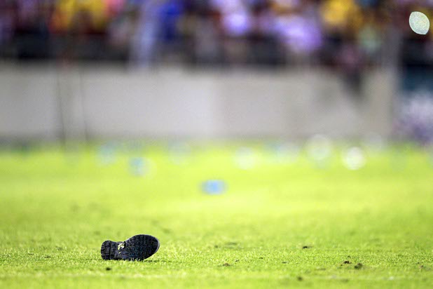 A shoe is thrown onto the field by Club America fans after Chivas Guadalajara scored during El Super Clasico soccer game at Sam Boyd Stadium Wednesday July 3, 2013.