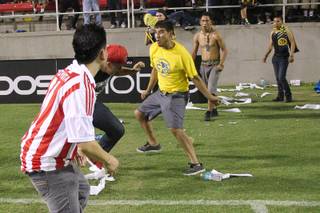 Fights break out on the field after El Super Clasico soccer game between Chivas and Club America Wednesday, July 3, 2013 at Sam Boyd Stadium.