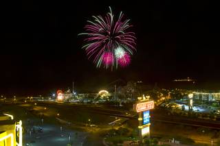 Fireworks explode over casinos during an 18-minute fireworks show in Primm Thursday, July 4, 2013.