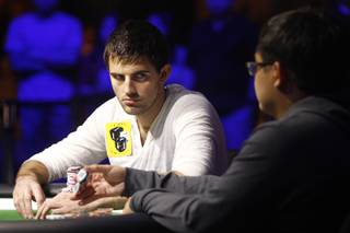 Matt Ashton stares at Don Nguyen while waiting for his move during the final table of the Poker Players Championship Thursday, July 4, 2013 at the Rio.