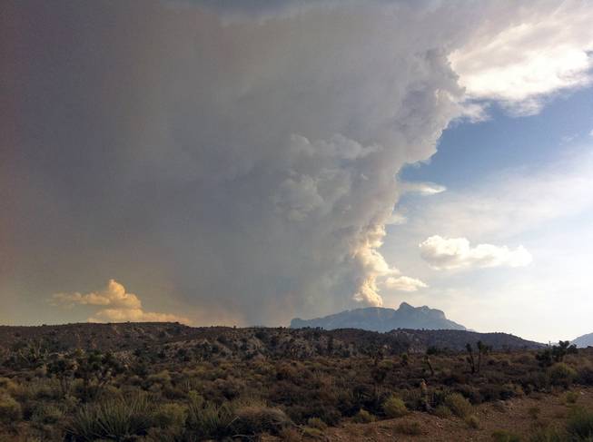 Smoke billows from a fire on Mount Charleston west of Las Vegas, Thursday, July 4, 2013.