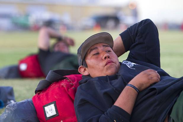 Firefighter Greg Cummins, based in Owyee, Nev. rests before making camp in Pahrump after fighting the Carpenter 1 wildfire Sunday, July 7, 2013.