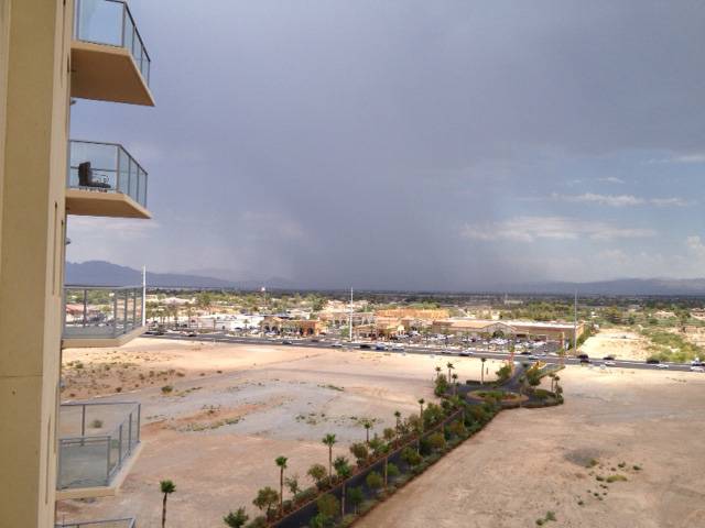 A thunderstorm moves north through the Las Vegas Valley about 12:45 p.m. Sunday. Rain in the area prompted the National Weather Service to issue a flash flood warning. 