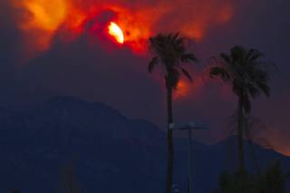 Smoke from the Mount Charleston wildfire makes for a fiery sunset Monday, July 8, 2013.